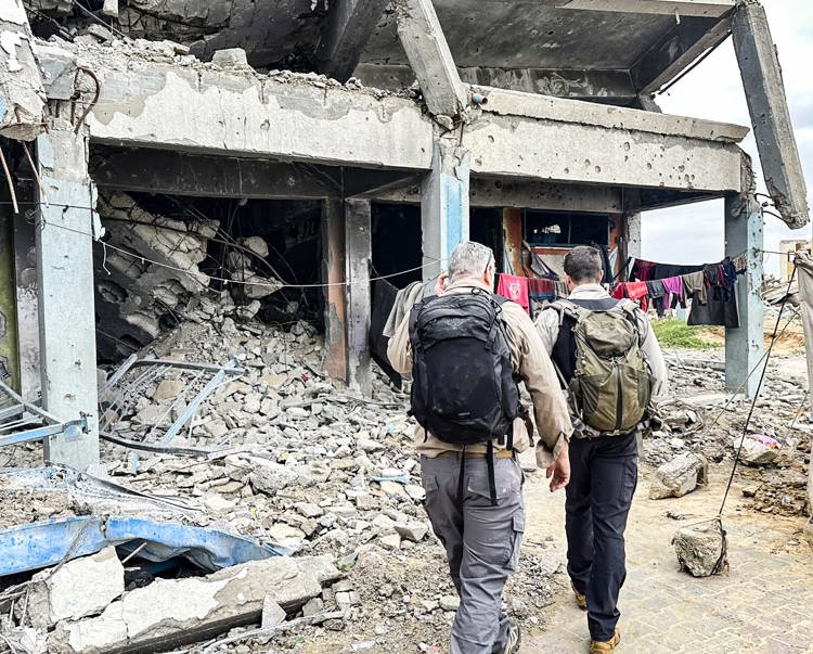 HALO staff surveying a bomb damaged school for unexploded ordnance